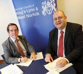 Material Works MD Robert Billson (left) signs the contract with King's Lynn and West Norfolk Cllr Brian Long